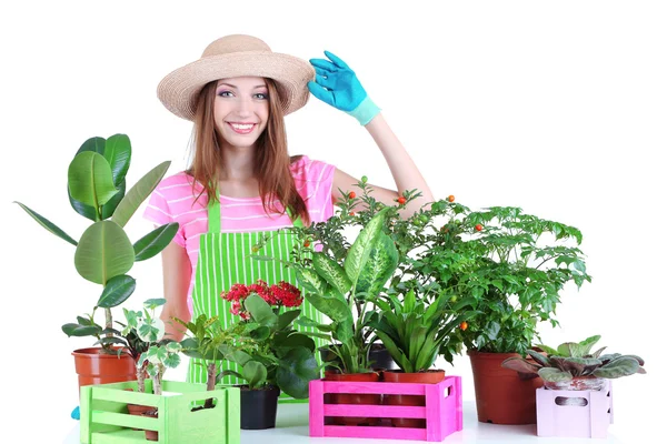 Bella ragazza giardiniere con fiori isolati su bianco — Foto Stock