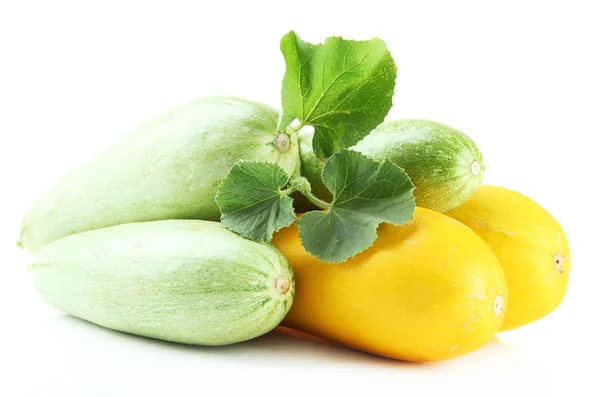 Raw yellow and green zucchini with leaves, isolated on white — Stock Photo, Image