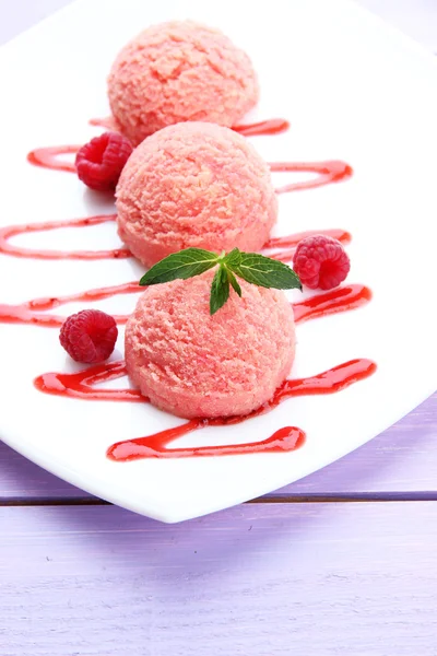 Delicious ice cream on plate on table close-up — Stock Photo, Image