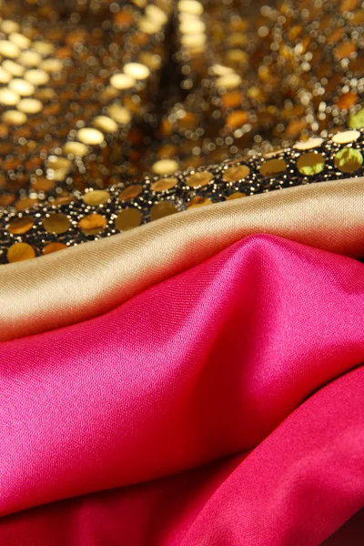 Hromadu různých textilií close-up pozadí — Stock fotografie
