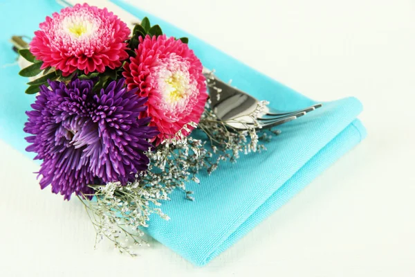 Festive dining table setting with flowers isolated on white — Stock Photo, Image