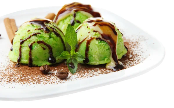 Delicioso helado en plato aislado en blanco — Foto de Stock