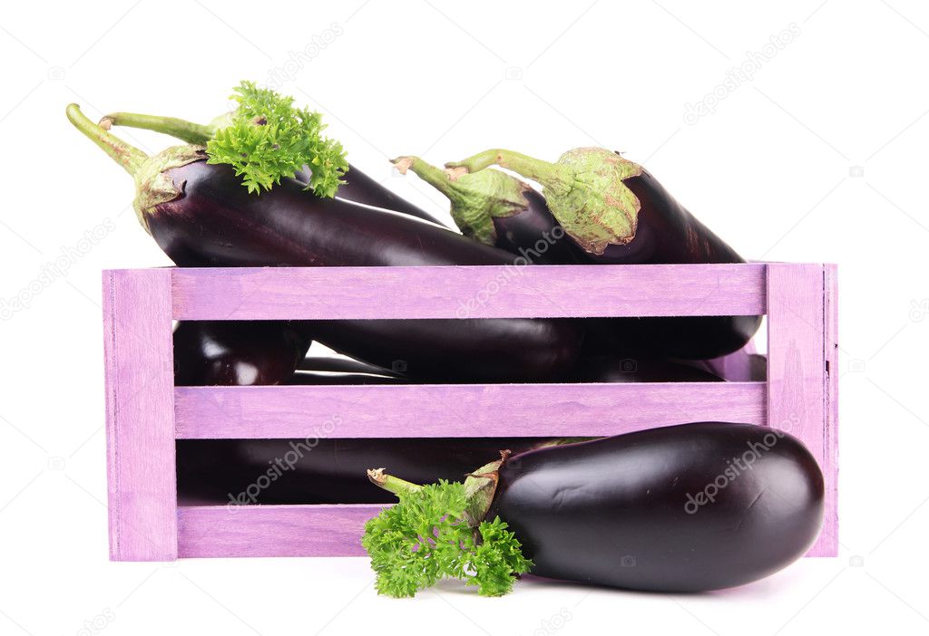 Fresh eggplants in wooden box isolated on white