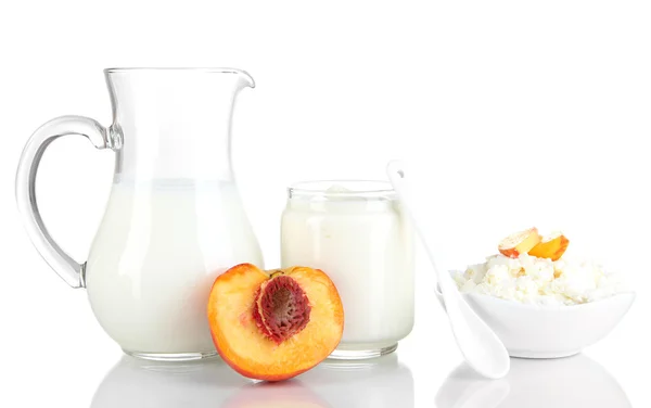 Fresh dairy products with peaches isolated on white — Stock Photo, Image