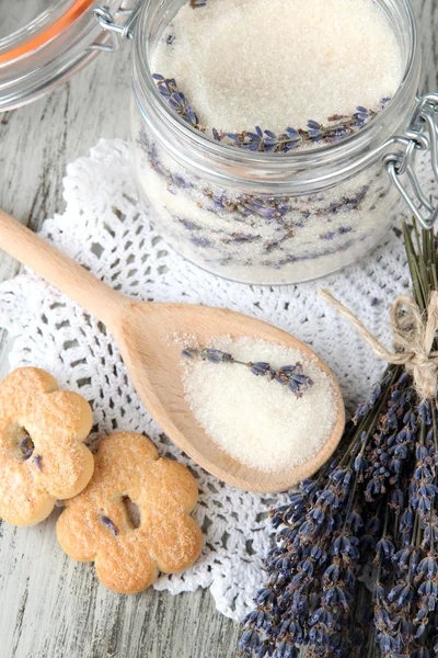 Jar of lavender sugar and fresh lavender flowers on wooden background — Stock Photo, Image