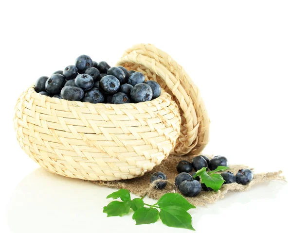 Blueberries in wooden basket on sackcloth isolated on white — Stock Photo, Image