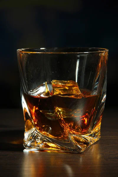 Glass of whiskey, on dark background — Stock Photo, Image