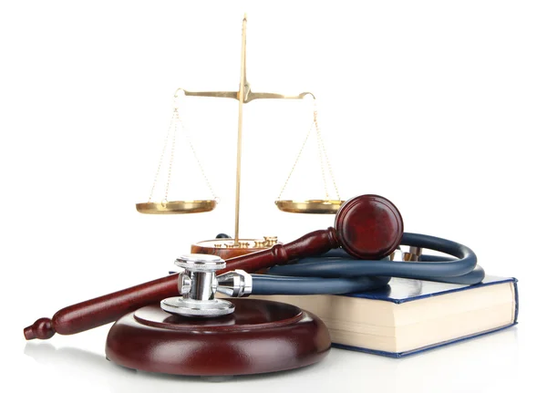 Medicine law concept. Gavel, scales and stethoscope on book isolated on white — Stock Photo, Image