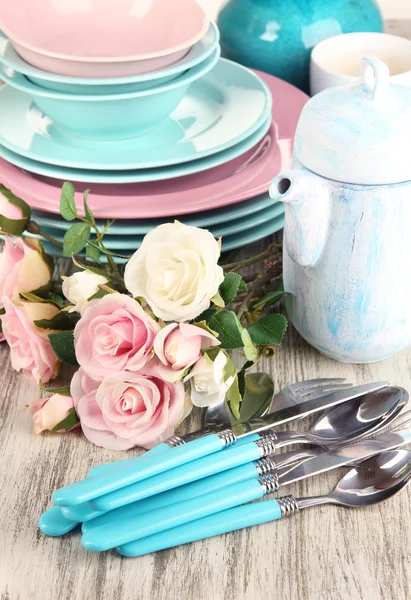 Lots beautiful dishes on wooden table close-up — Stock Photo, Image