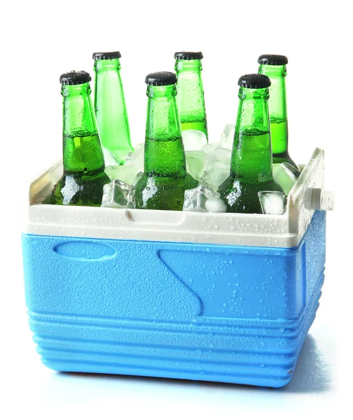Bottles of beer with ice cubes in mini refrigerator, isolated on white — Stock Photo, Image