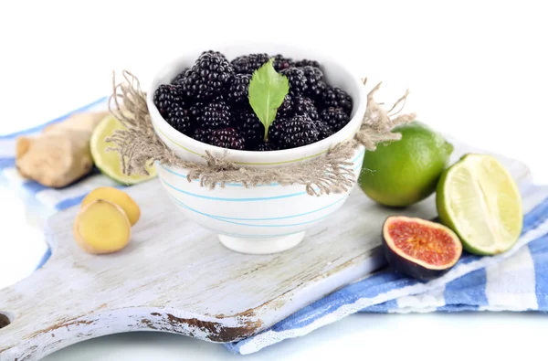Blackberry in small bowl on board on napkin isolated on white — Stock Photo, Image