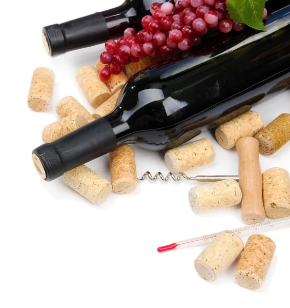 Bottles of wine, grapes and corks, isolated on white — Stock Photo, Image