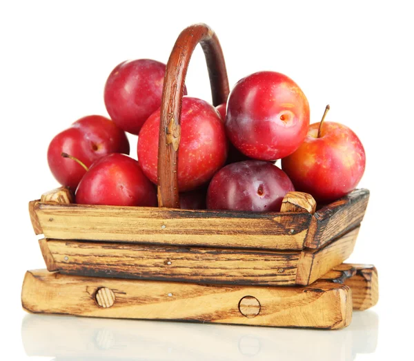 Ripe plums in basket isolated on white — Stock Photo, Image