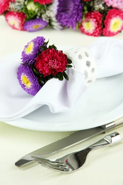 Festive dining table setting with flowers isolated on white — Stock Photo, Image