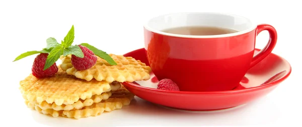 Cup of tea with cookies and raspberries isolated on white — Stock Photo, Image