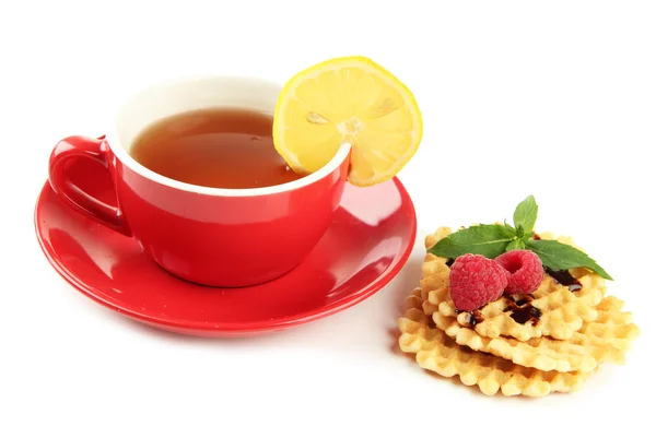 Cup of tea with cookies and raspberries isolated on white — Stock Photo, Image