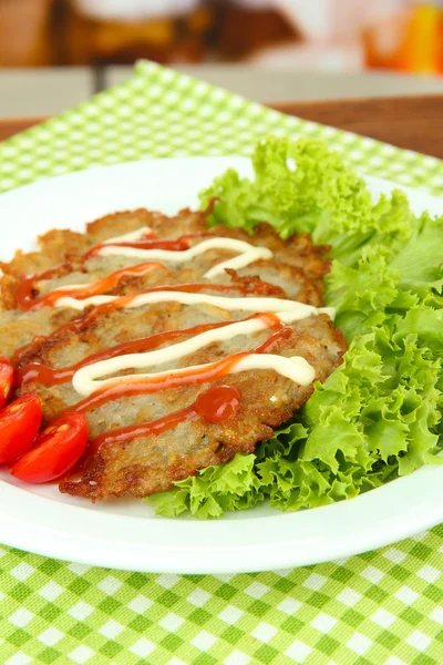 Potato pancakes on plate, on bright background — Stock Photo, Image