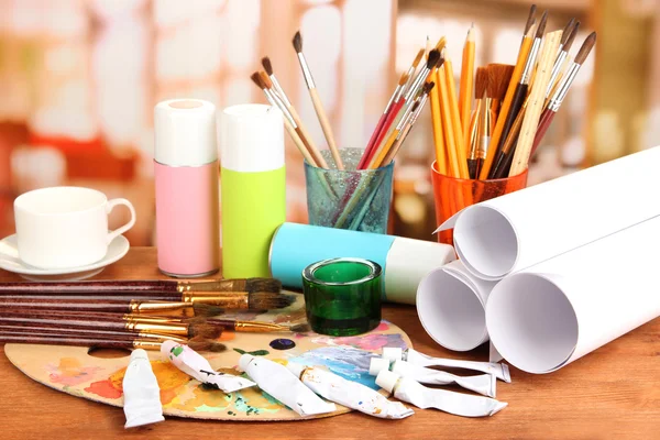 Artistic equipment: paint, brushes and art palette — Stock Photo, Image