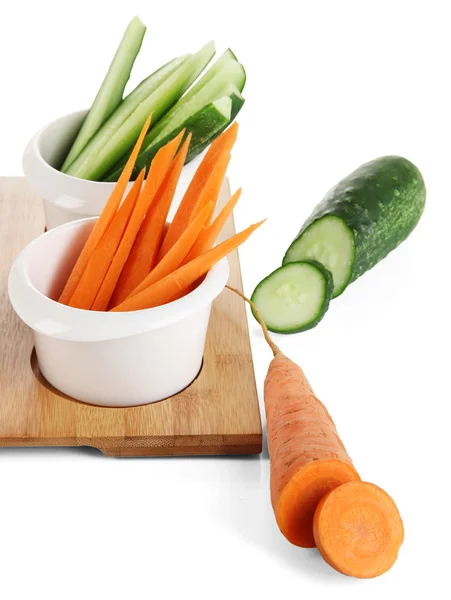 Bright fresh vegetables cut up slices in bowls isolated on white — Stock Photo, Image