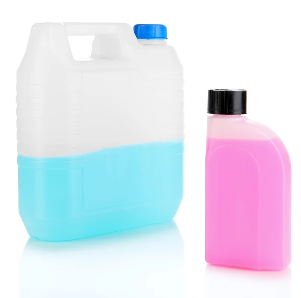 Blue and pink liquids for car in canisters isolated on white — Stock Photo, Image