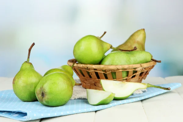 Pears in wicker basket, on light background — Stock Photo, Image