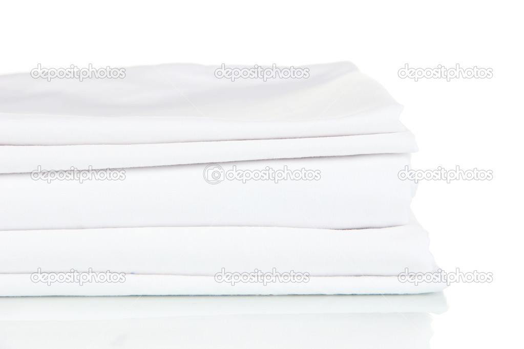 Stack of clean bedding sheets isolated on white