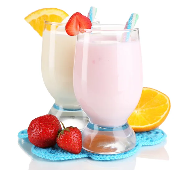 Delicious milk shakes with orange and strawberries isolated on white — Stock Photo, Image