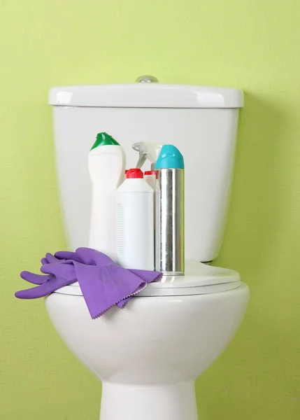 White toilet bowl and cleaner bottle in a bathroom — Stock Photo, Image