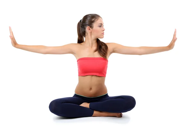 Young beautiful fitness girl doing yoga exercise isolated on white Stock Image