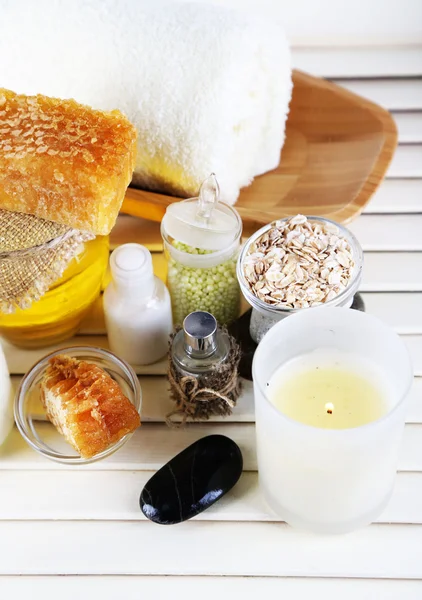 Honey and milk spa with oils and honey on wooden table close-up — Stock Photo, Image