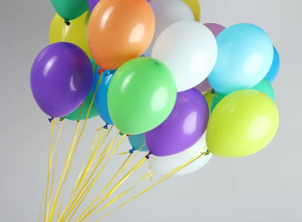 Colorful balloons on grey background — Stock Photo, Image