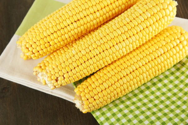 Crude corns on wooden table — Stock Photo, Image