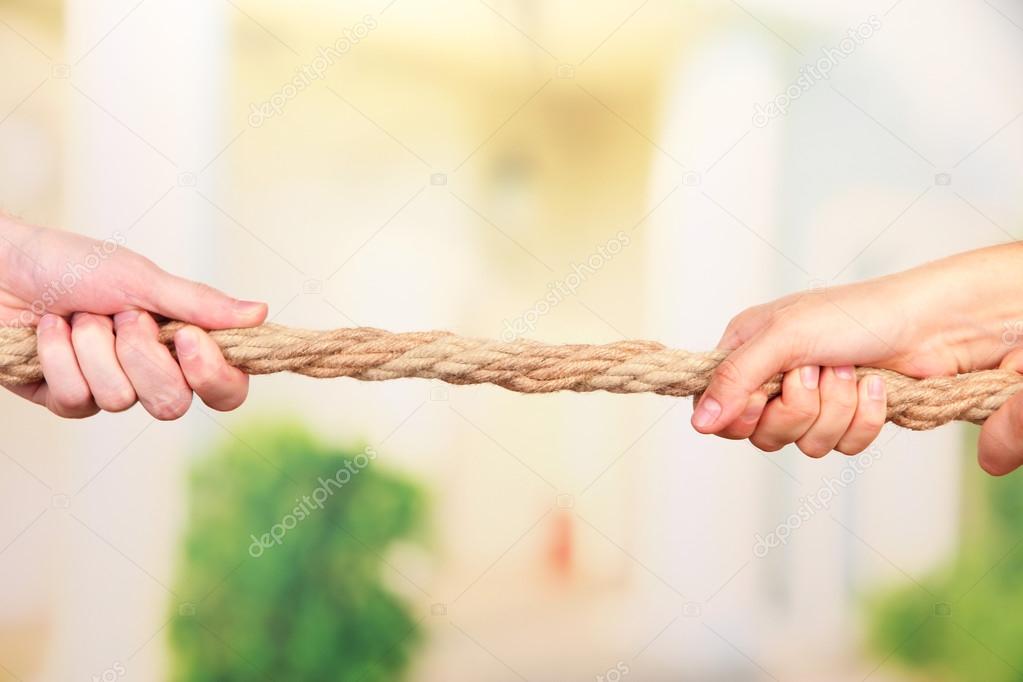 Tug of war, on bright background