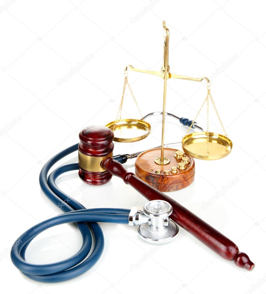 Medicine law concept. Gavel, scales and stethoscope isolated on white