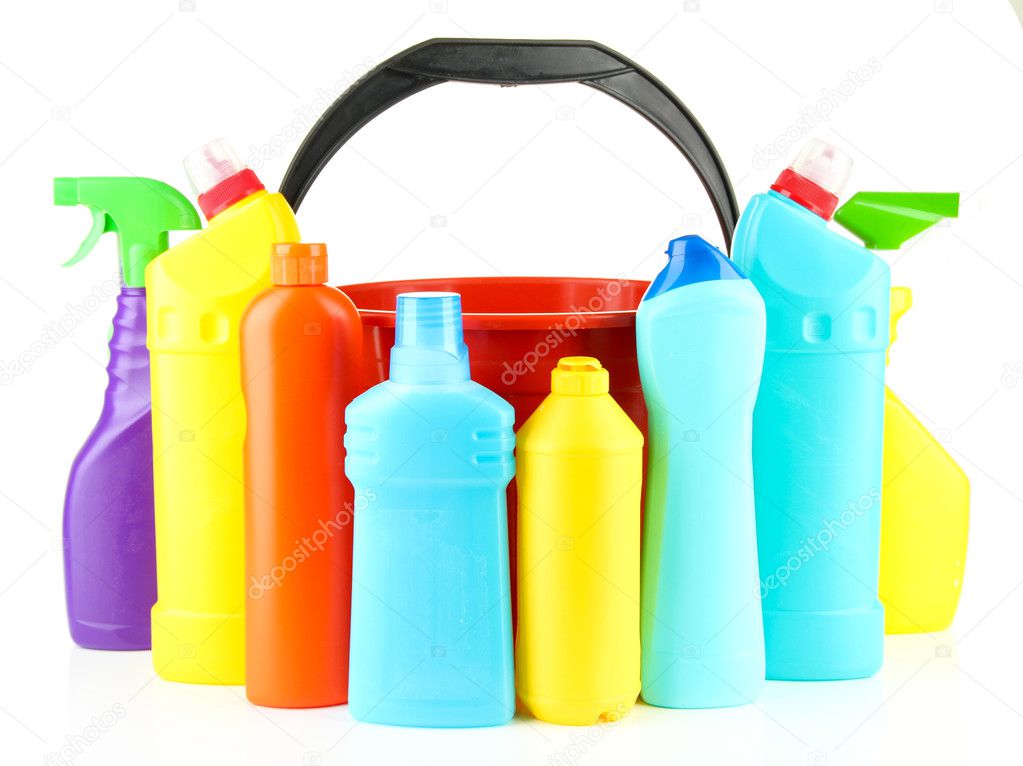 Colorful plastic detergent bottles with bucket, isolated on white