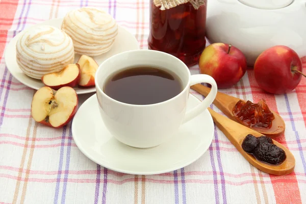 Light breakfast with tea and homemade jam, on tablecloth — Stock Photo, Image