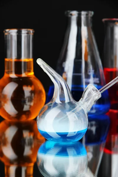 Laboratory glassware on black background — Stock Photo, Image