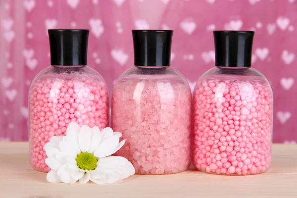 Aromatherapy minerals - colorful bath salt on pink background — Stock Photo, Image