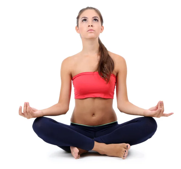 Jovem bela menina fitness fazendo exercício de ioga isolado no branco — Fotografia de Stock