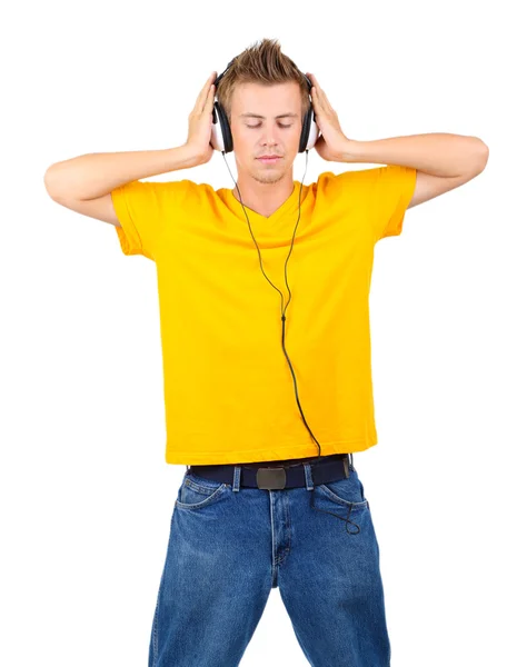 Bonito jovem ouvindo música isolada no branco — Fotografia de Stock