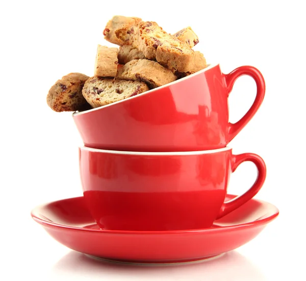 Tasty cookies in cups isolated on white — Stock Photo, Image