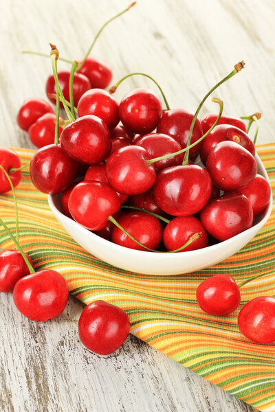 Cherry berries on wooden table close up