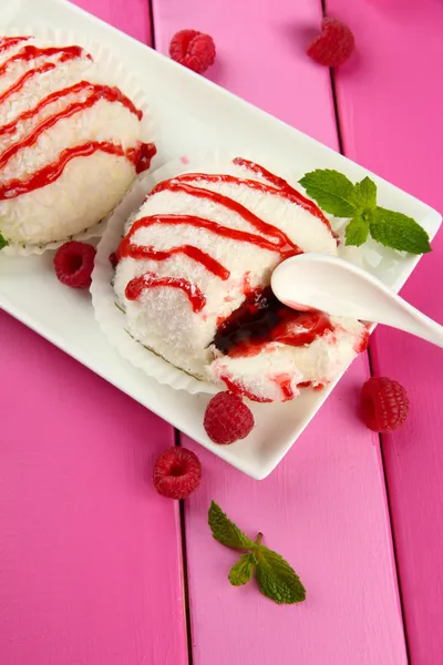 Delicious coconut cakes on plate on table close-up — Stock Photo, Image