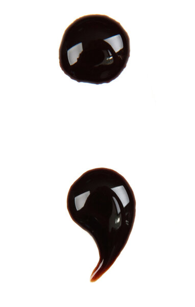 Punctuation mark made from chocolate syrup, isolated on white