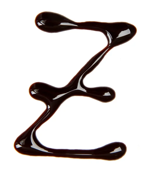 Small letter of alphabet made from chocolate syrup, isolated on white — Stock Photo, Image