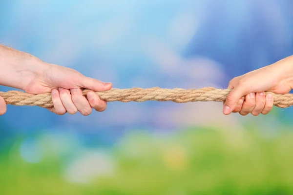 Tug of war, on bright background — Stock Photo, Image