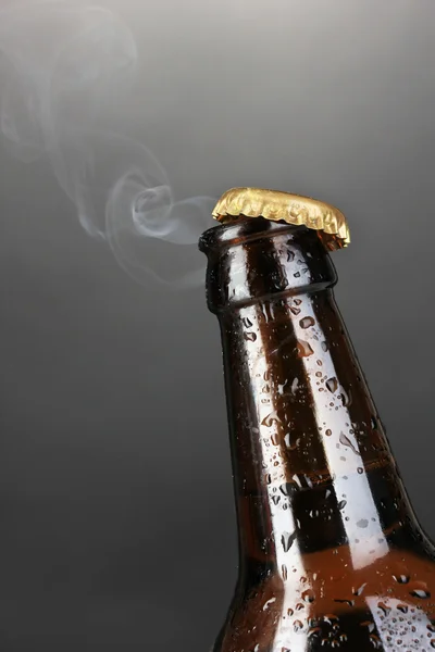 Top of open wet beer bottle on dark background — Stock Photo, Image