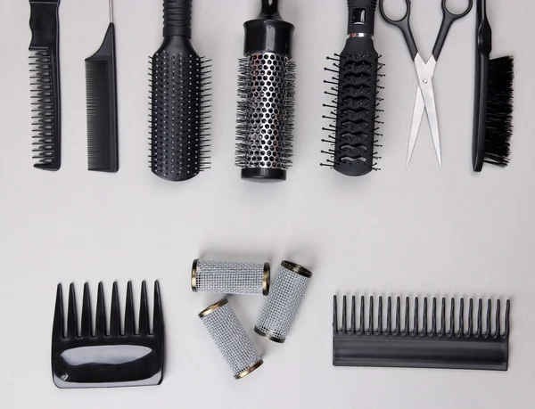 Professional hairdresser tools on gray background — Stock Photo, Image