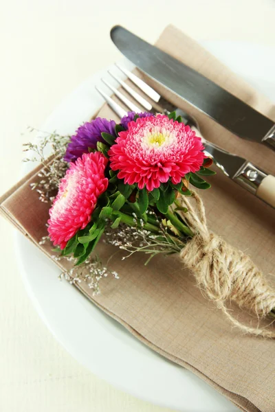 Festive dining table setting with flowers isolated on white — Stock Photo, Image
