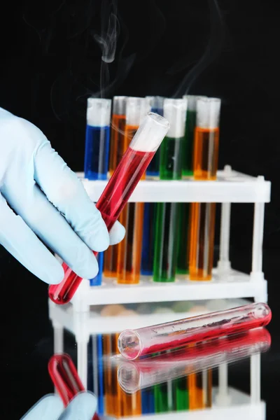 Laboratory test tubes on black background — Stock Photo, Image